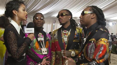 Migos on Their Matching Versace Suits .